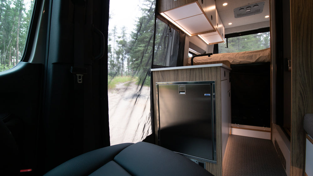 Hand-built cabinetry interior in a 2Pines Sprinter 144 camper van