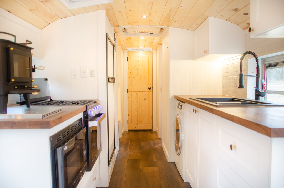 Farmhouse modern school bus conversion with wood roof