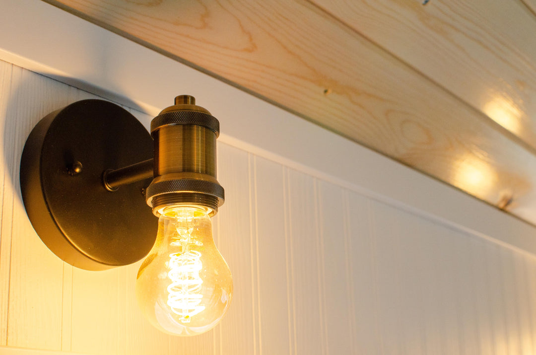 Sconces in the skoolie bedroom